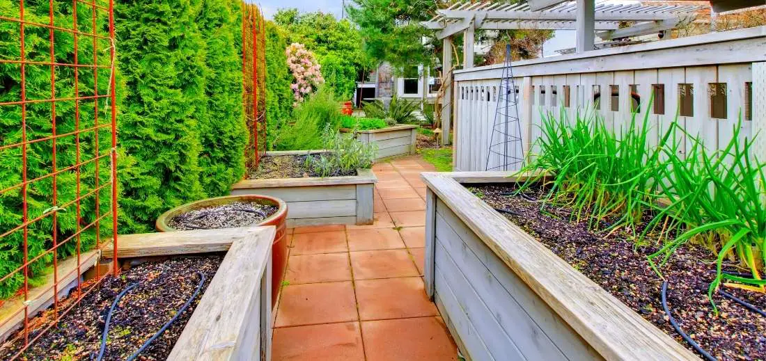 How to Build a Raised Bed Along a Fence - Bed Gardening
